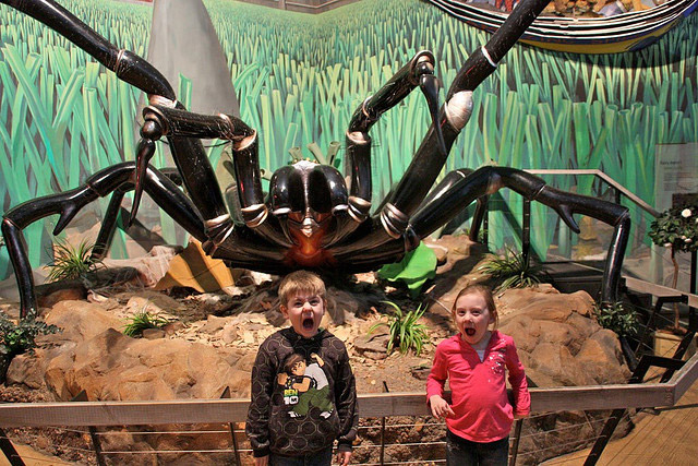 Two Small humanoids used as scale reference for animatronic spider
