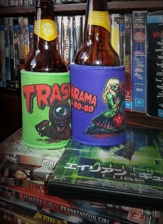 Purple Trasharama agogo stubbie holder sitting atop the japanese release of home grown queensland scifi-horror film the Dark lurking aka Alien in cube