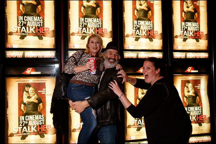 John Jarrat and Fans in front of a bank of Stalkher Film Posters